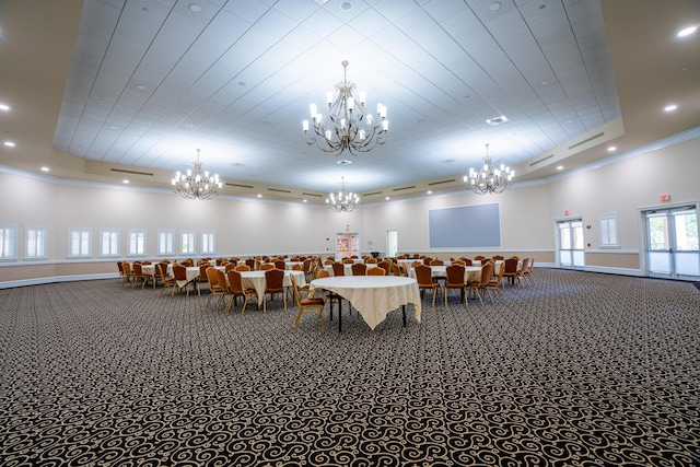 unfurnished dining area with crown molding, carpet floors, a tray ceiling, and recessed lighting