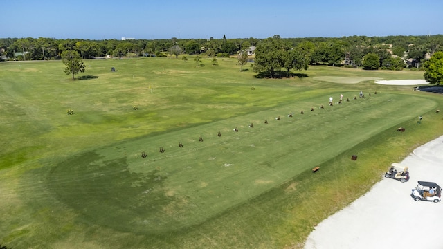 birds eye view of property with view of golf course