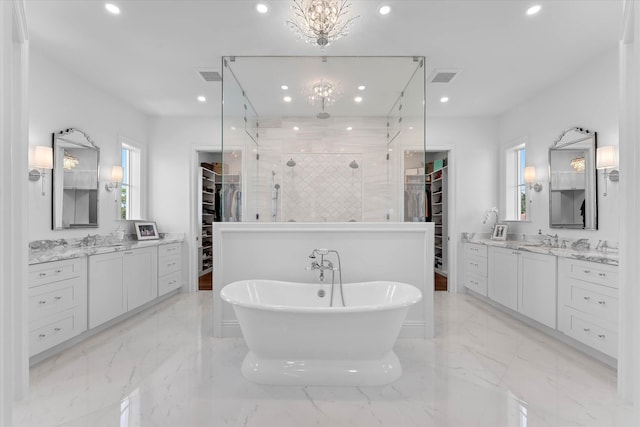 bathroom featuring recessed lighting, a sink, visible vents, marble finish floor, and a stall shower