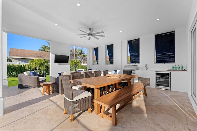 dining room featuring wine cooler, a ceiling fan, and recessed lighting