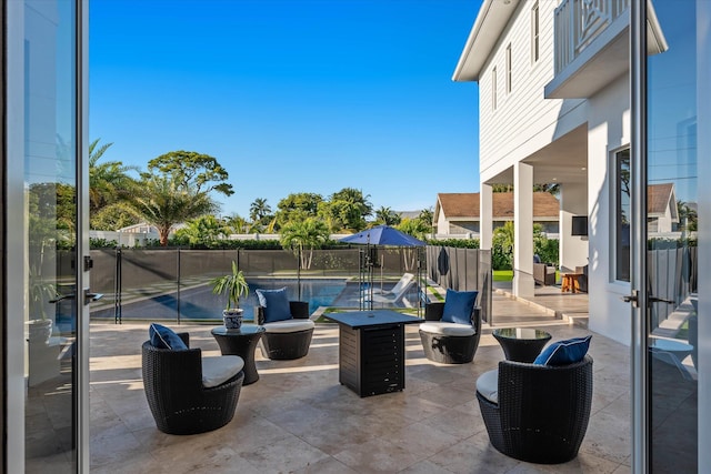 view of patio featuring a fenced in pool and fence