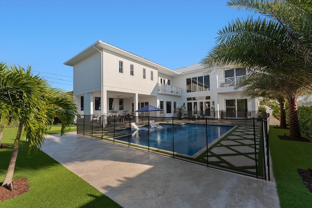 view of pool with a patio area, fence, and a fenced in pool