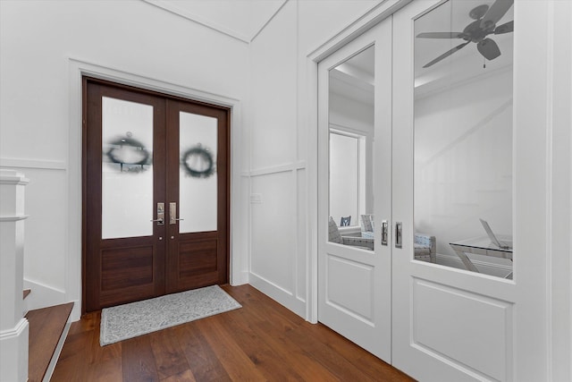 entrance foyer with dark wood-style floors, a ceiling fan, and french doors