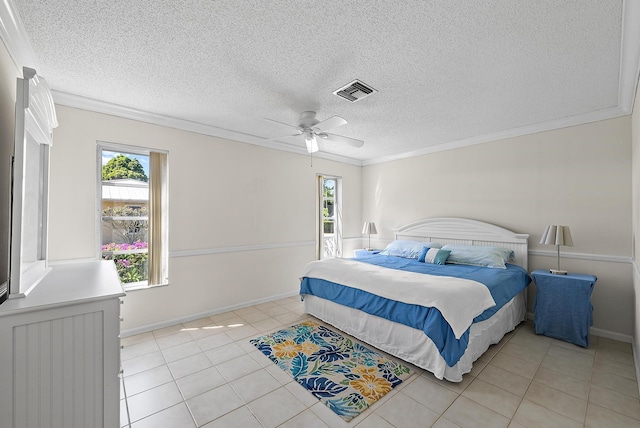 bedroom featuring visible vents, multiple windows, ornamental molding, and light tile patterned flooring