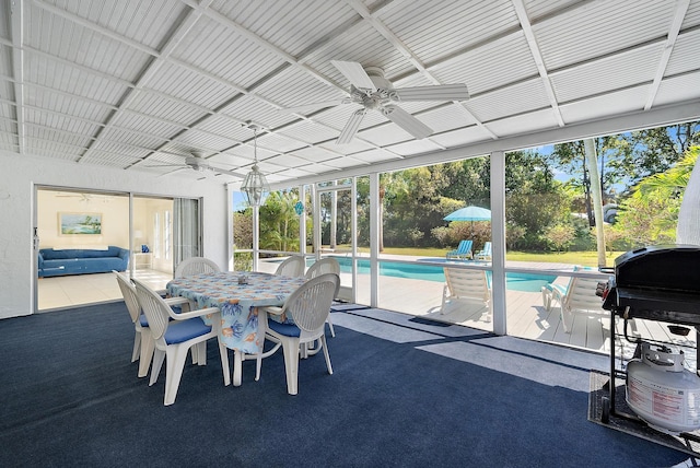 sunroom with a ceiling fan