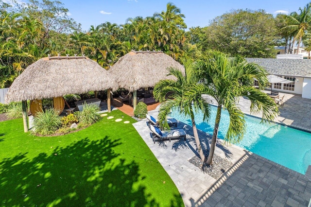 view of pool featuring a gazebo, a yard, a patio area, and a fenced in pool