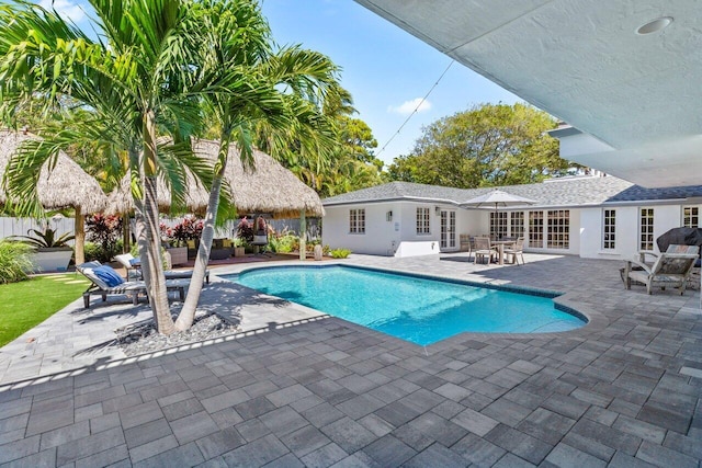 view of swimming pool with a gazebo, french doors, and a patio area