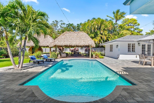 view of swimming pool featuring a patio area, a gazebo, outdoor lounge area, and french doors