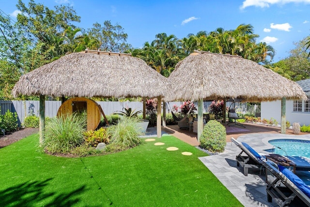 view of yard featuring a gazebo, a patio, fence private yard, and a fenced in pool