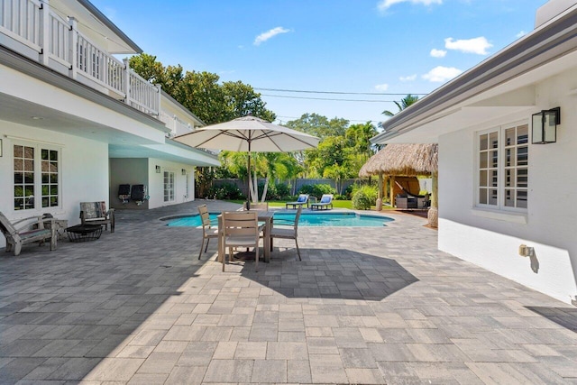 view of pool featuring fence, a fenced in pool, and a patio