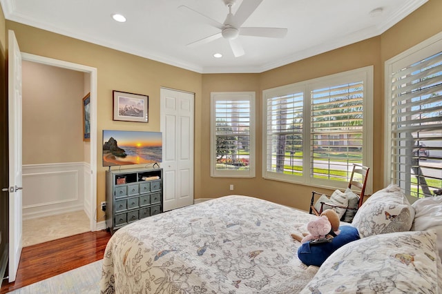 bedroom featuring crown molding, dark wood-style flooring, and recessed lighting