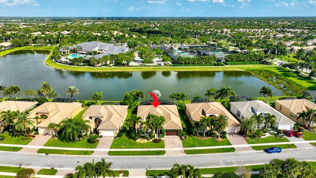 drone / aerial view featuring a residential view and a water view