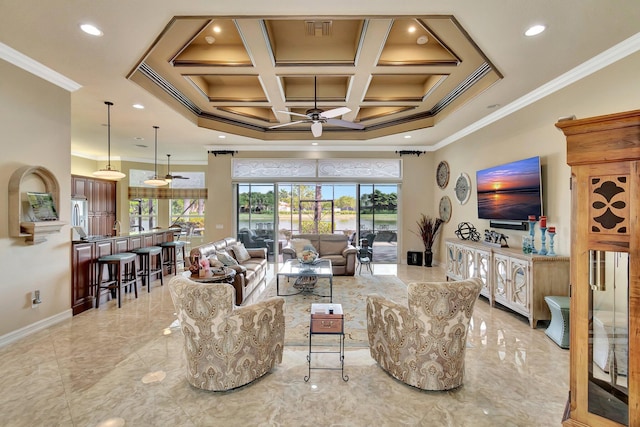 living area with plenty of natural light, coffered ceiling, a ceiling fan, and crown molding