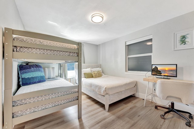 bedroom with wood finished floors