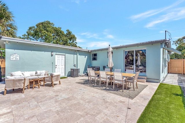 back of house featuring a patio, fence, outdoor dining area, cooling unit, and an outdoor living space