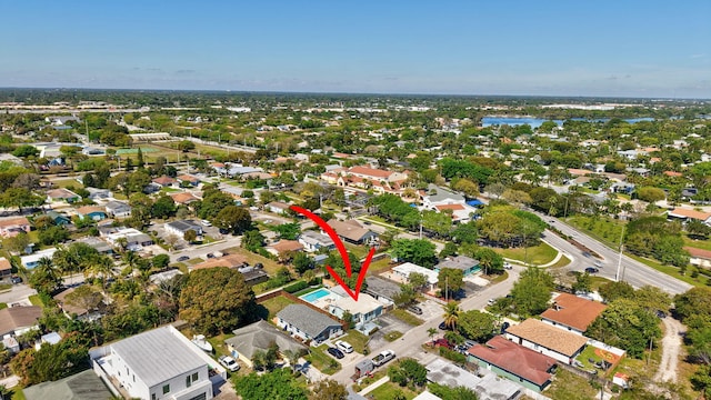 bird's eye view with a residential view and a water view