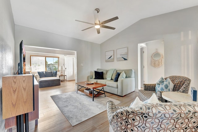 living room featuring light wood-style floors, high vaulted ceiling, and a ceiling fan