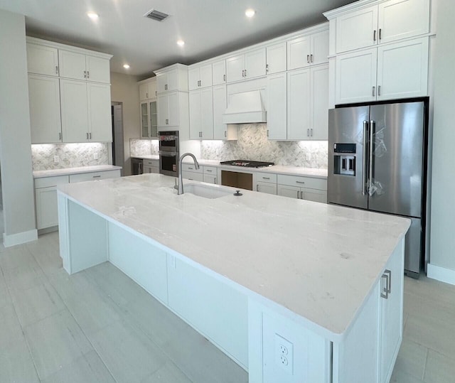 12727 Nevins Ln Unit Renown 61, Palm Beach Gardens, FL 33412 - kitchen featuring stainless steel appliances, premium range hood, decorative backsplash, a large island, and recessed lighting