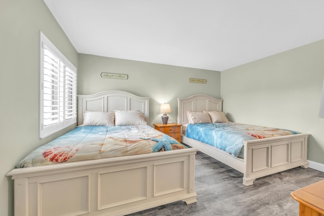 bedroom featuring wood finished floors