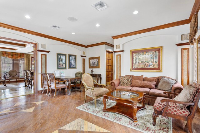 living area with light wood finished floors, visible vents, and recessed lighting