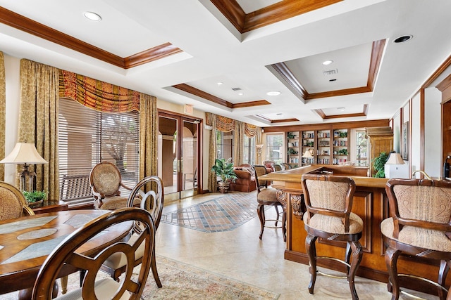 dining space featuring wet bar, visible vents, coffered ceiling, and crown molding