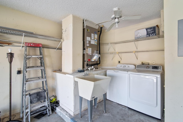 washroom featuring laundry area, electric panel, ceiling fan, a textured ceiling, and separate washer and dryer