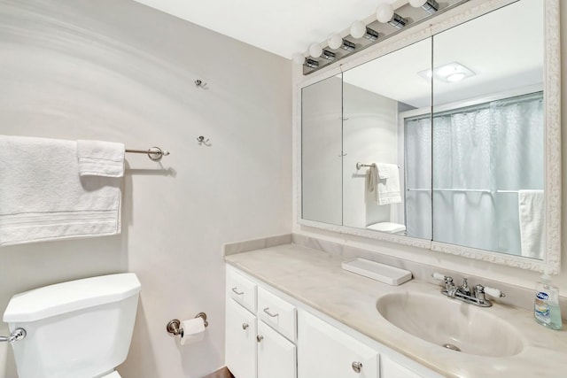 full bathroom with toilet, a shower with shower curtain, and vanity