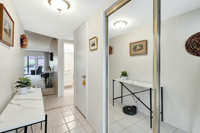 hallway featuring light tile patterned floors