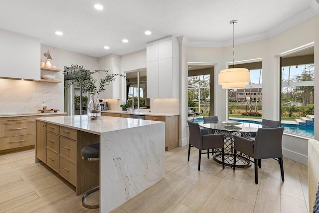 kitchen with light wood finished floors, open shelves, backsplash, ornamental molding, and modern cabinets