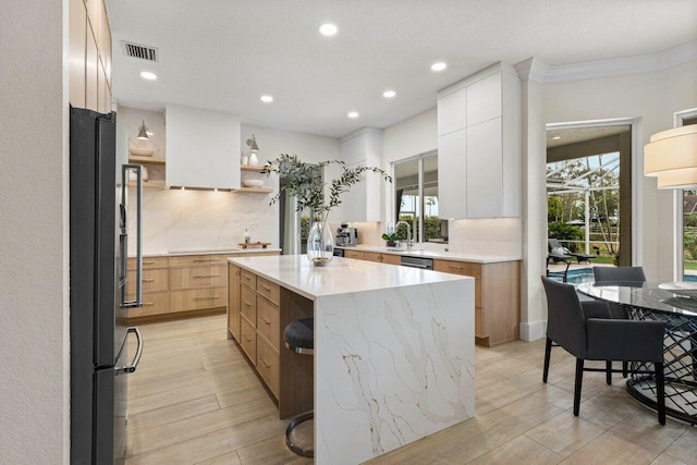 kitchen with open shelves, tasteful backsplash, visible vents, stainless steel dishwasher, and freestanding refrigerator