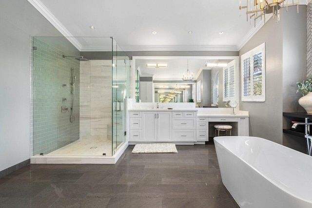 bathroom featuring a freestanding bath, ornamental molding, a shower stall, and a notable chandelier