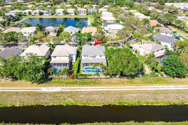 aerial view with a residential view and a water view