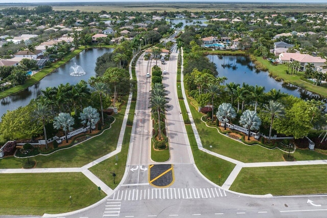 birds eye view of property featuring a residential view and a water view