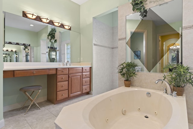 full bathroom featuring vanity, tile patterned floors, and a jetted tub