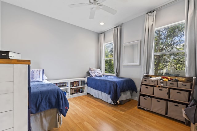 bedroom featuring recessed lighting, multiple windows, light wood-style floors, and ceiling fan