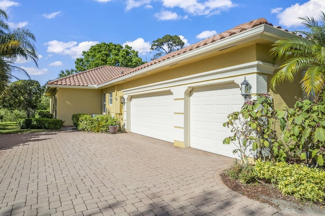 exterior space featuring decorative driveway