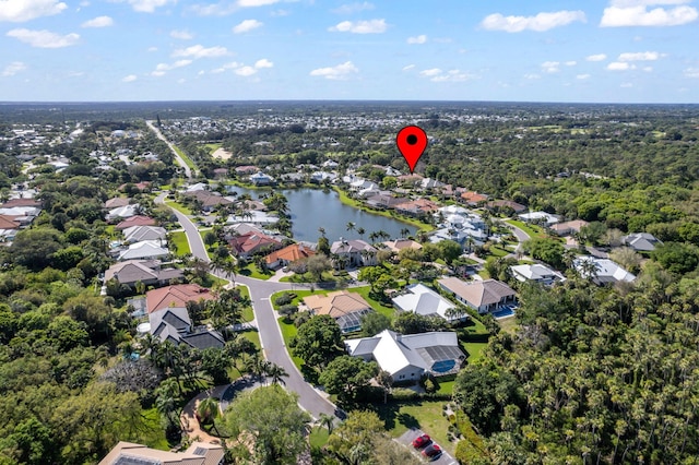 birds eye view of property featuring a residential view and a water view