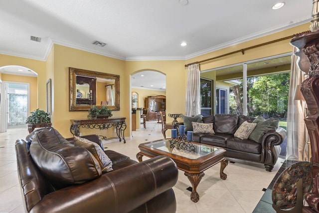 living room featuring light tile patterned floors, visible vents, and plenty of natural light