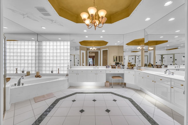 bathroom featuring tile patterned flooring, a raised ceiling, a notable chandelier, and a shower stall