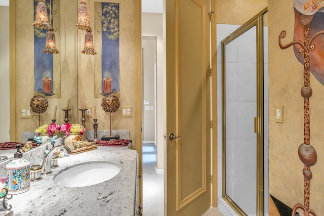 bathroom featuring a stall shower and vanity