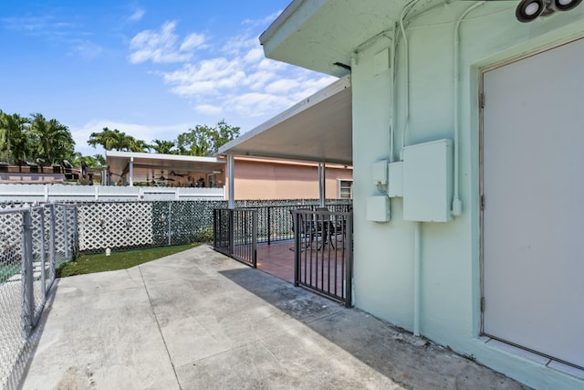 view of patio featuring fence