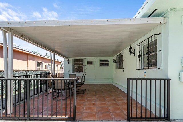 view of patio with outdoor dining area and fence