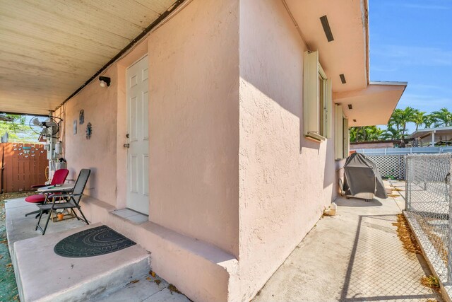 view of patio / terrace featuring fence