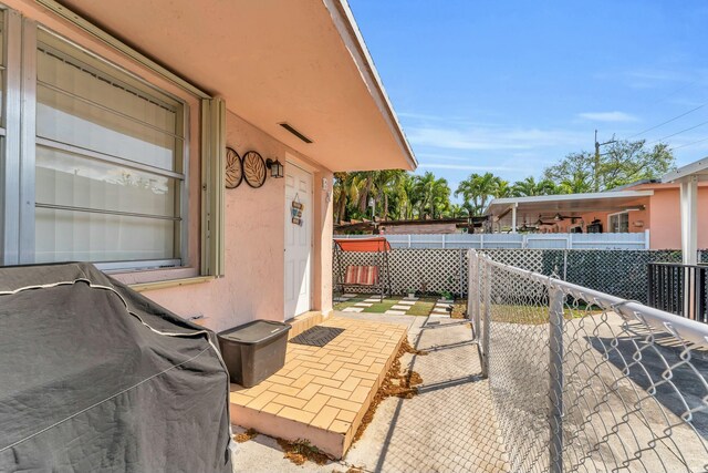 view of patio featuring fence