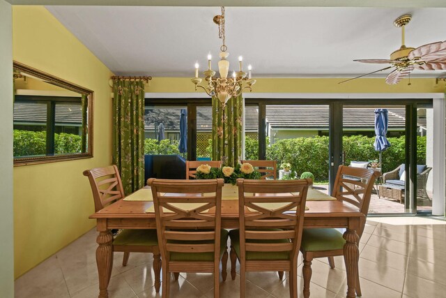 dining room with light tile patterned floors and a chandelier