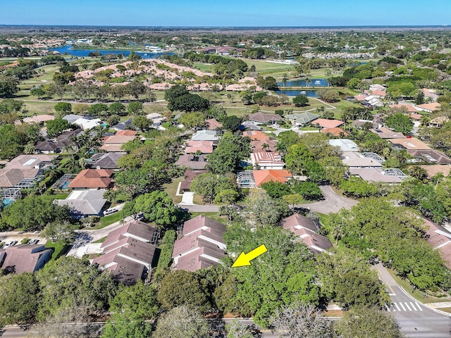 bird's eye view featuring a water view and a residential view