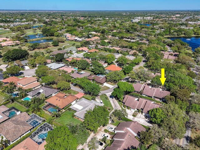 bird's eye view with a water view and a residential view