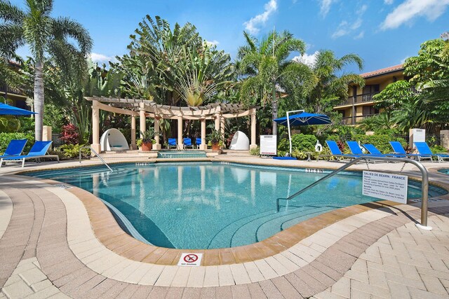 pool featuring a patio area and a pergola