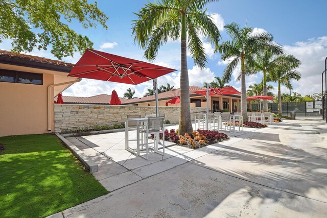 view of patio featuring fence