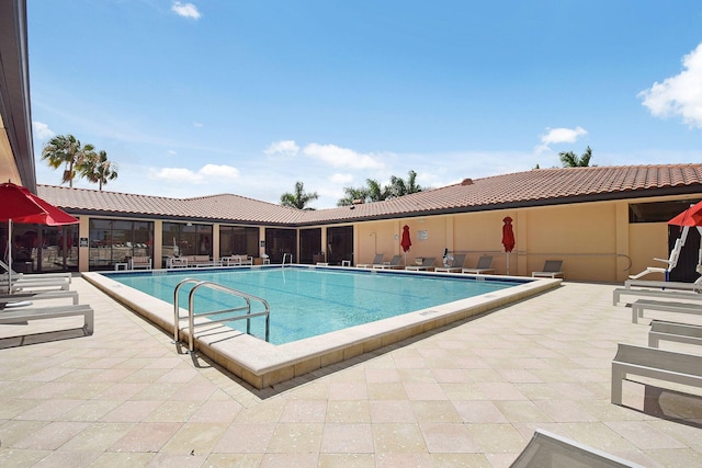 pool with a patio area